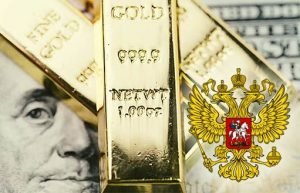 Золото падает на укреплении доллара, банки РФ наращивают запасы